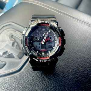 Casio Men's Watch G-Shock Black and Red Ana-Digital Dial Strap Watch GA100-1A4